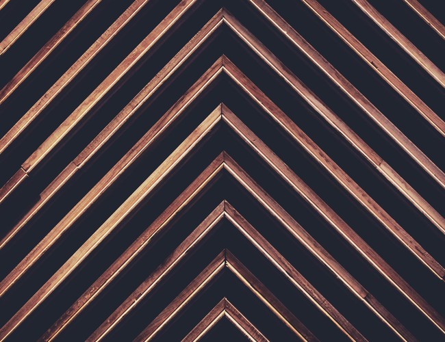 Diagonal wooden pattern with geometric shapes creating a modern abstract background.